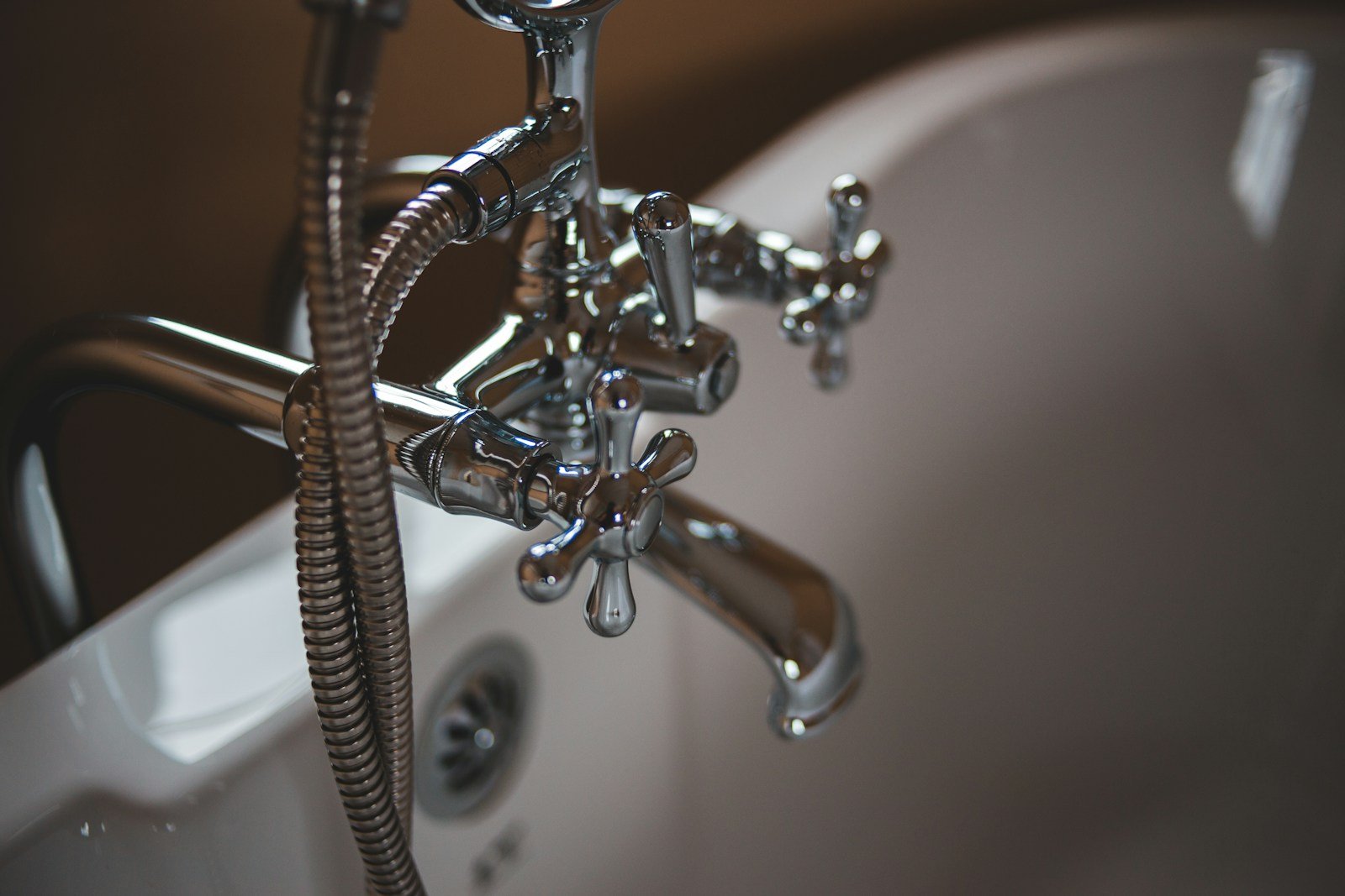 Plumber working on pipes in a San Jose home